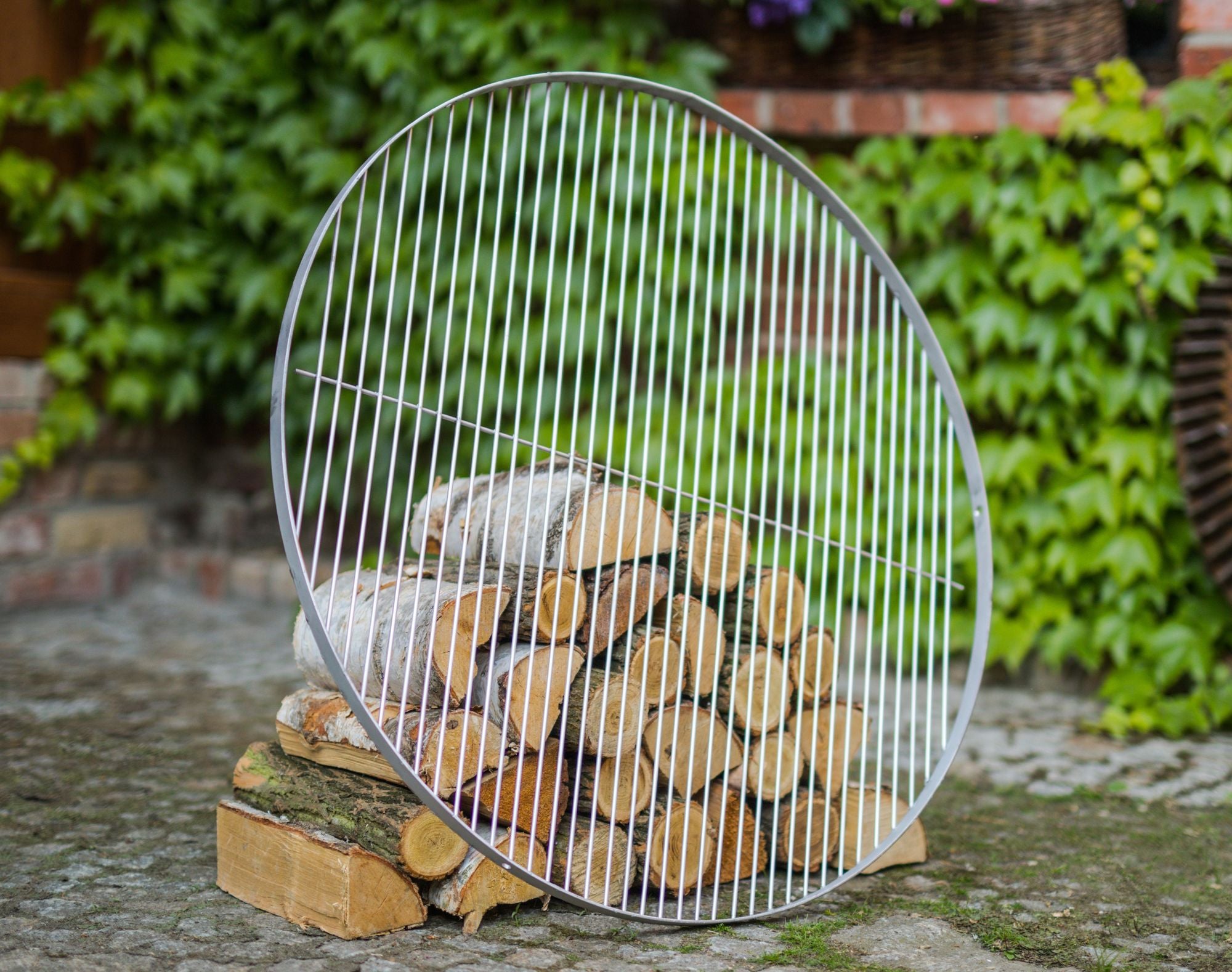 Cook King 50 cm Stainless Steel Grate in an outdoor setting