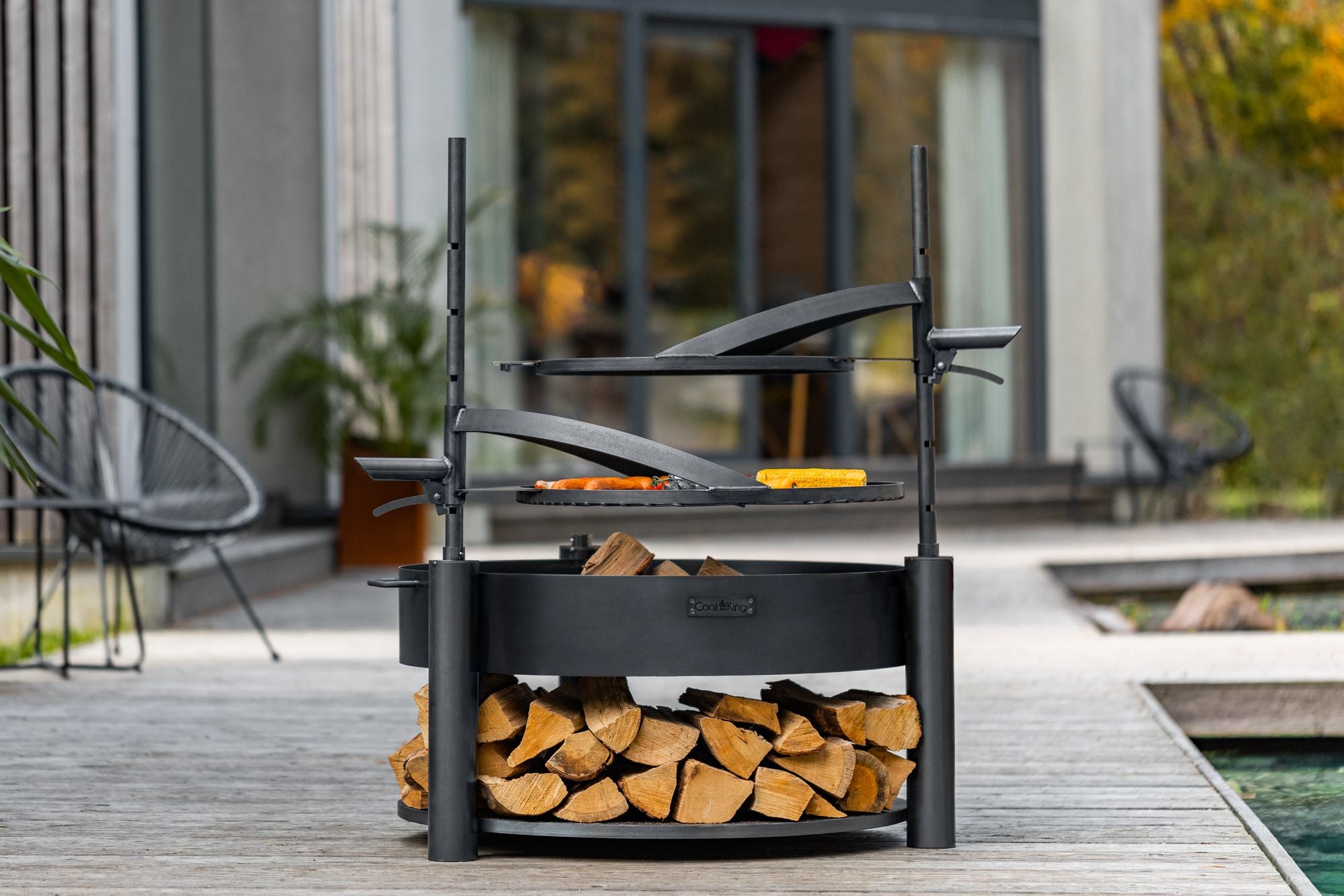 Cook King Montana X 60cm Multifunctional Fire Bowl with 50cm Grate in an outdoor setting