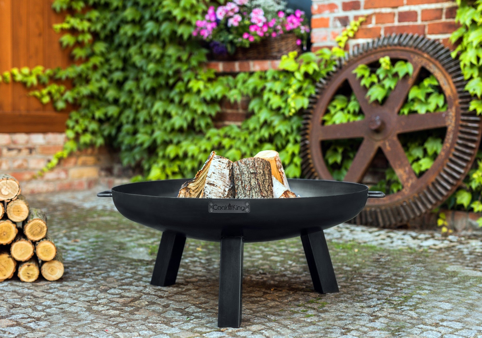 Cook King Polo 60cm Fire Bowl in an outdoor setting