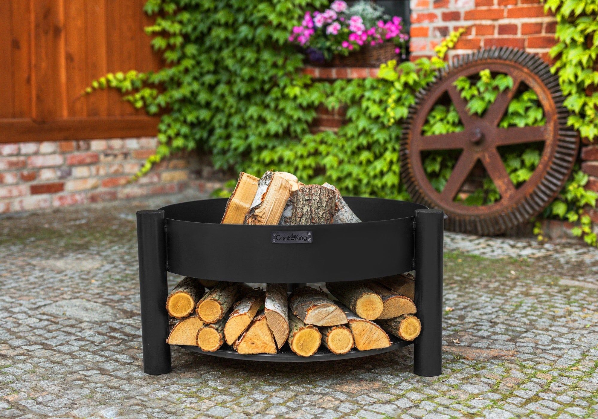 Cook King Montana 60cm Fire Bowl in an outdoor setting