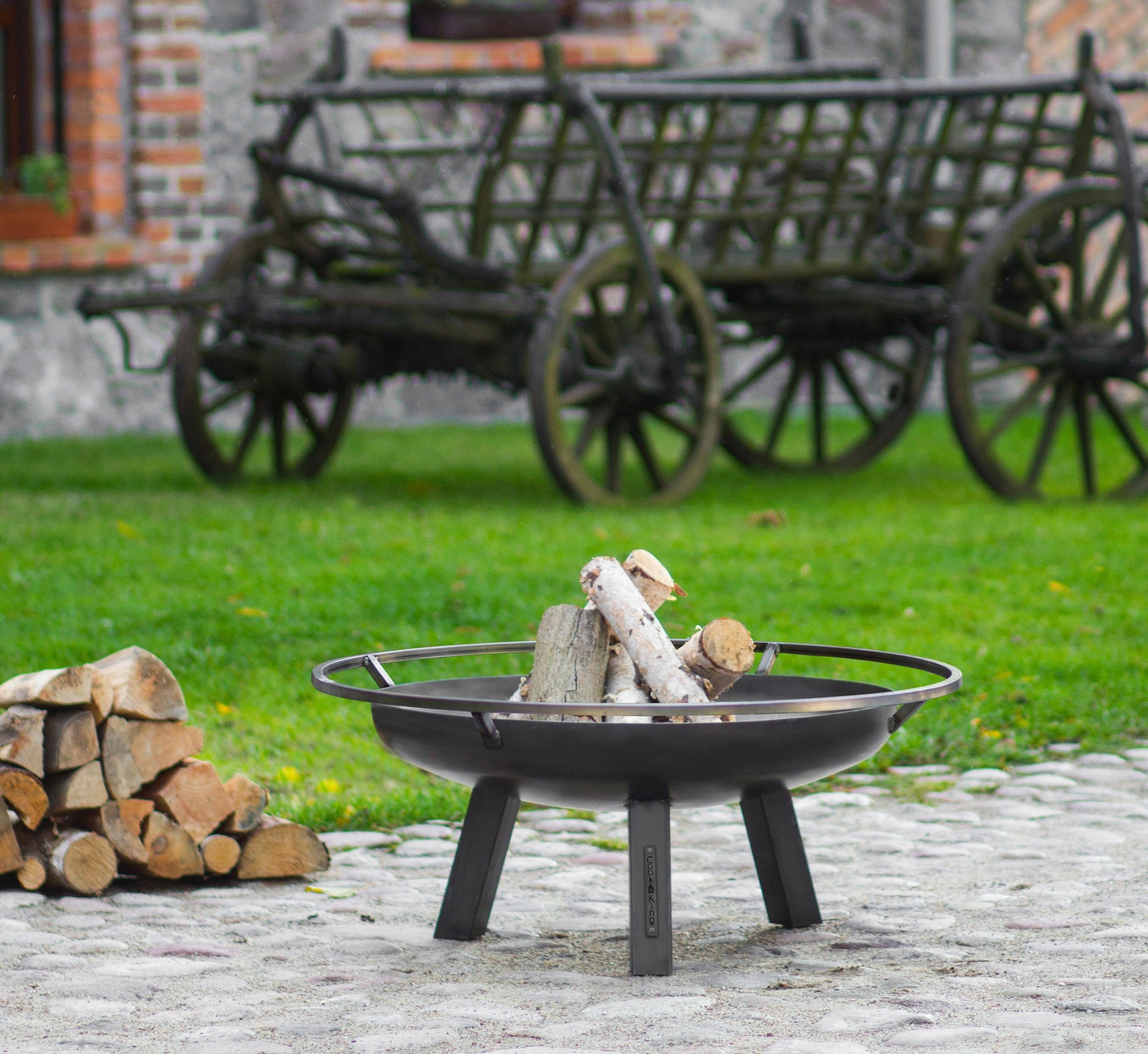 Cook King Porto 60cm Fire Bowl in an outdoor setting