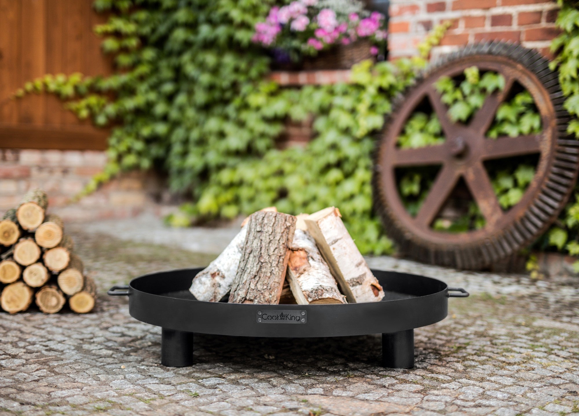 Cook King Tunis 80cm Fire Bowl in an outdoor setting