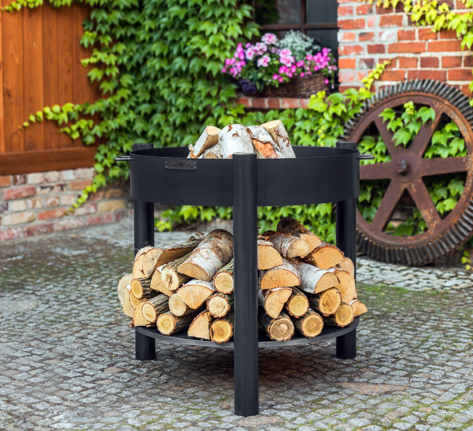 Cook King Montana Tall 60cm Fire Bowl in an outdoor setting