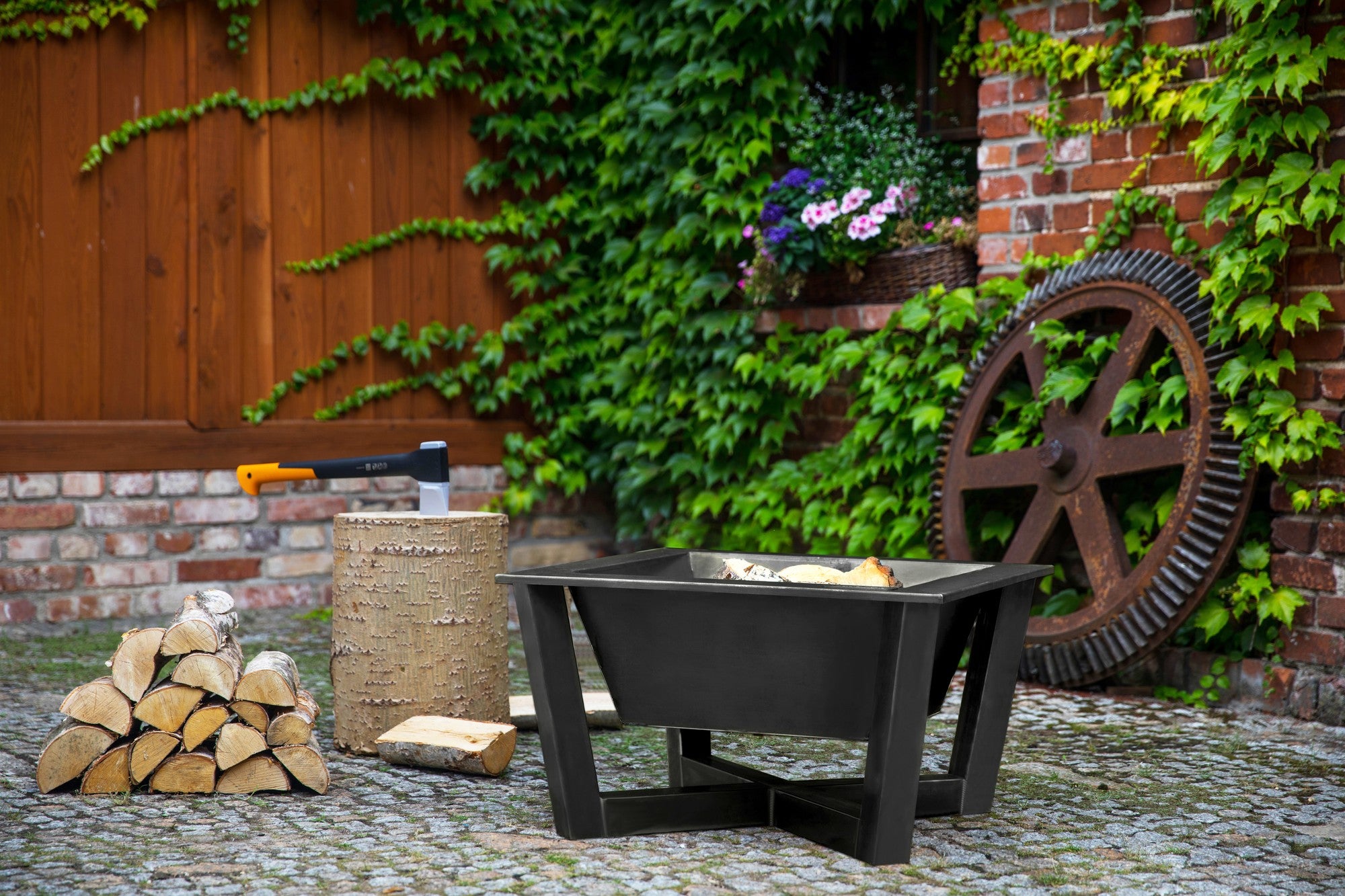 Cook King Brasil 70x70cm Fire Bowl in an outdoor setting