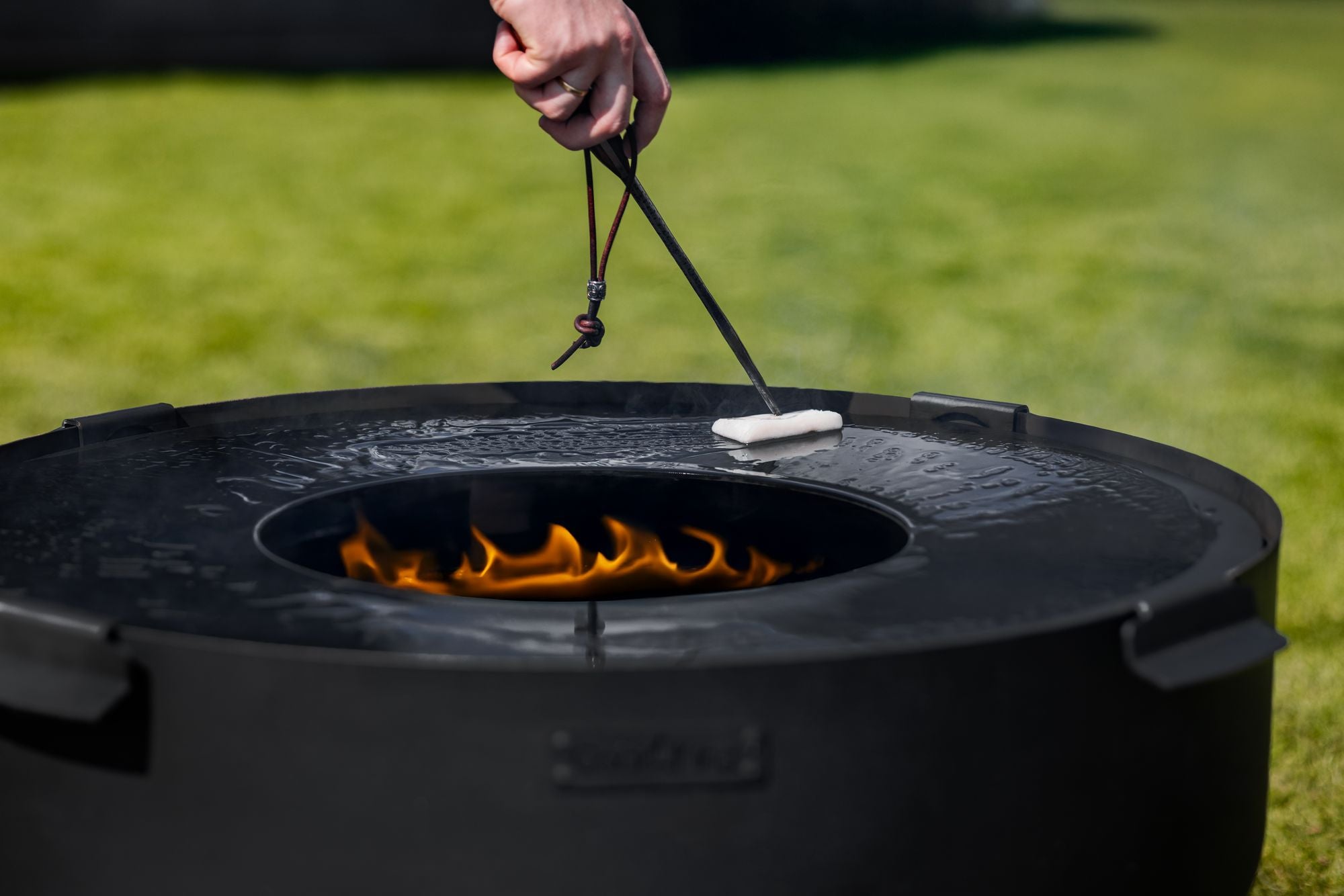 Cook King Viking XXL 60cm Fire Bowl in an outdoor setting