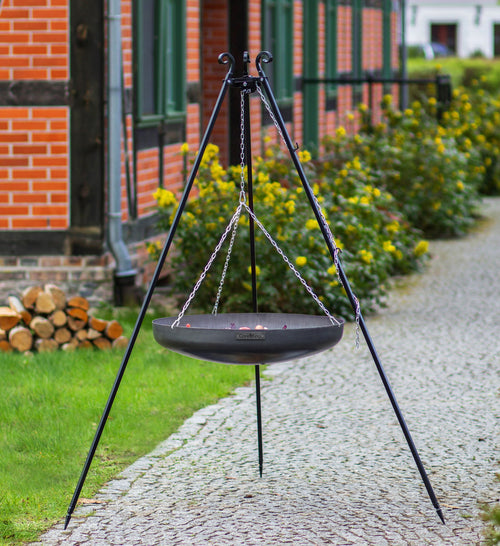 Cook King 180 cm Tripod Wok with Winch and 70 cm Natural Steel Wok in an outdoor setting
