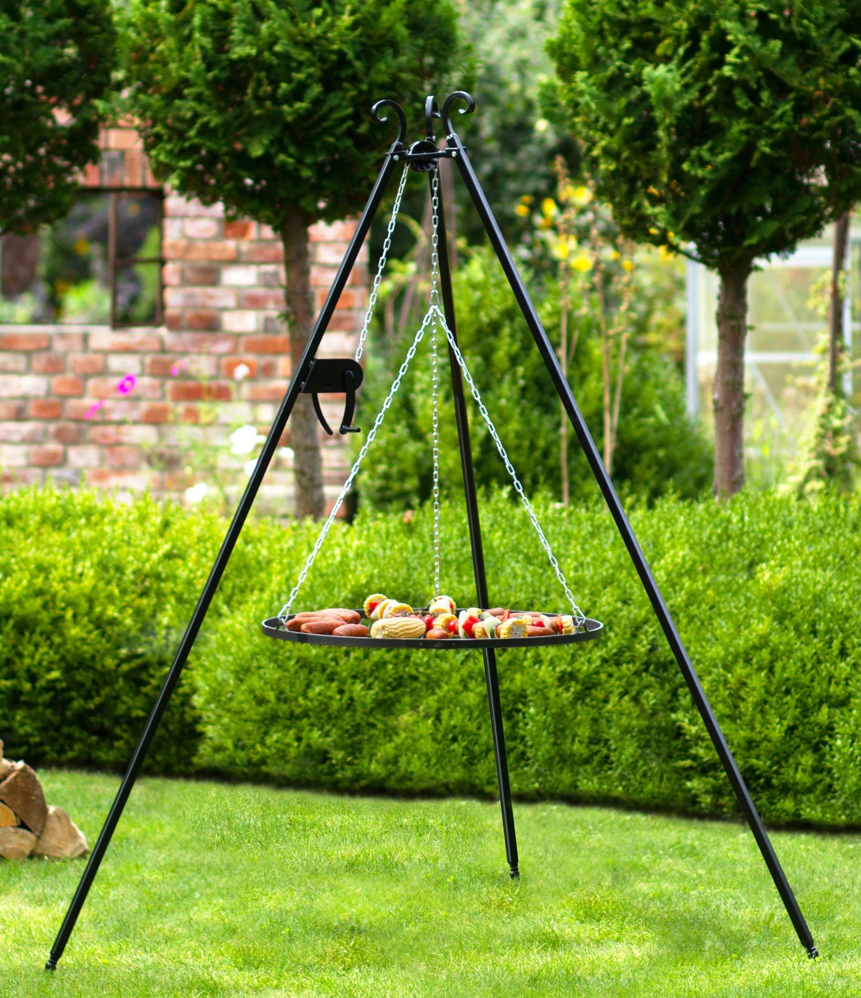 Cook King 180 cm Tripod with 70 cm Natural Steel Grate in an outdoor setting