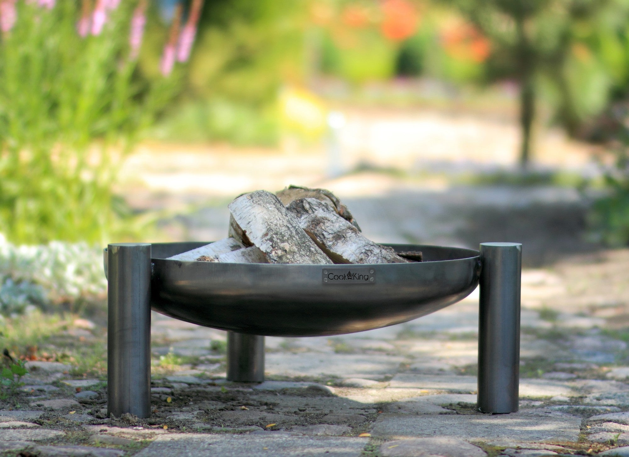 Cook King Palma 60cm Fire Bowl in an outdoor setting
