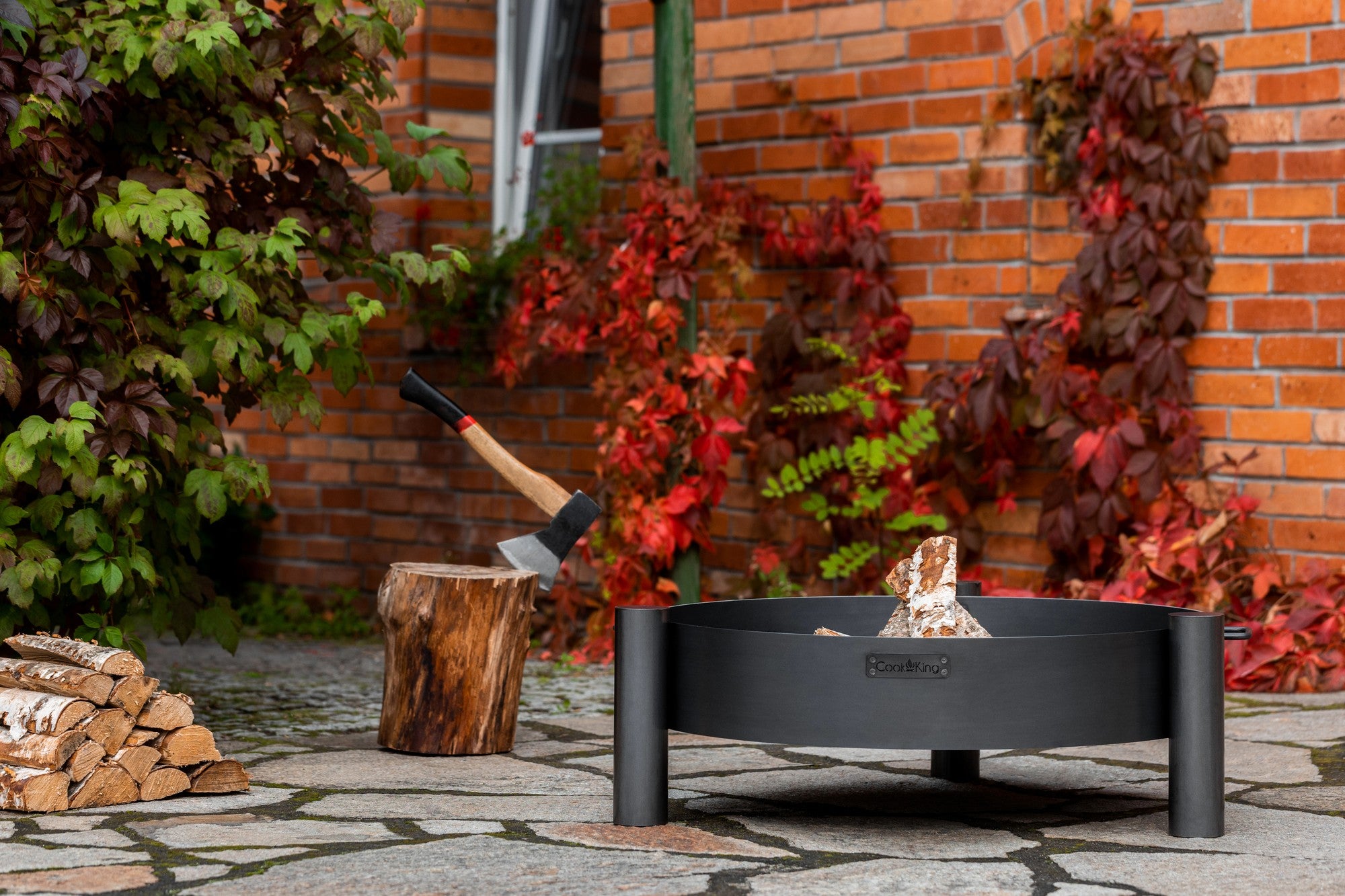 Cook King Haiti 80cm Fire Bowl in an outdoor setting
