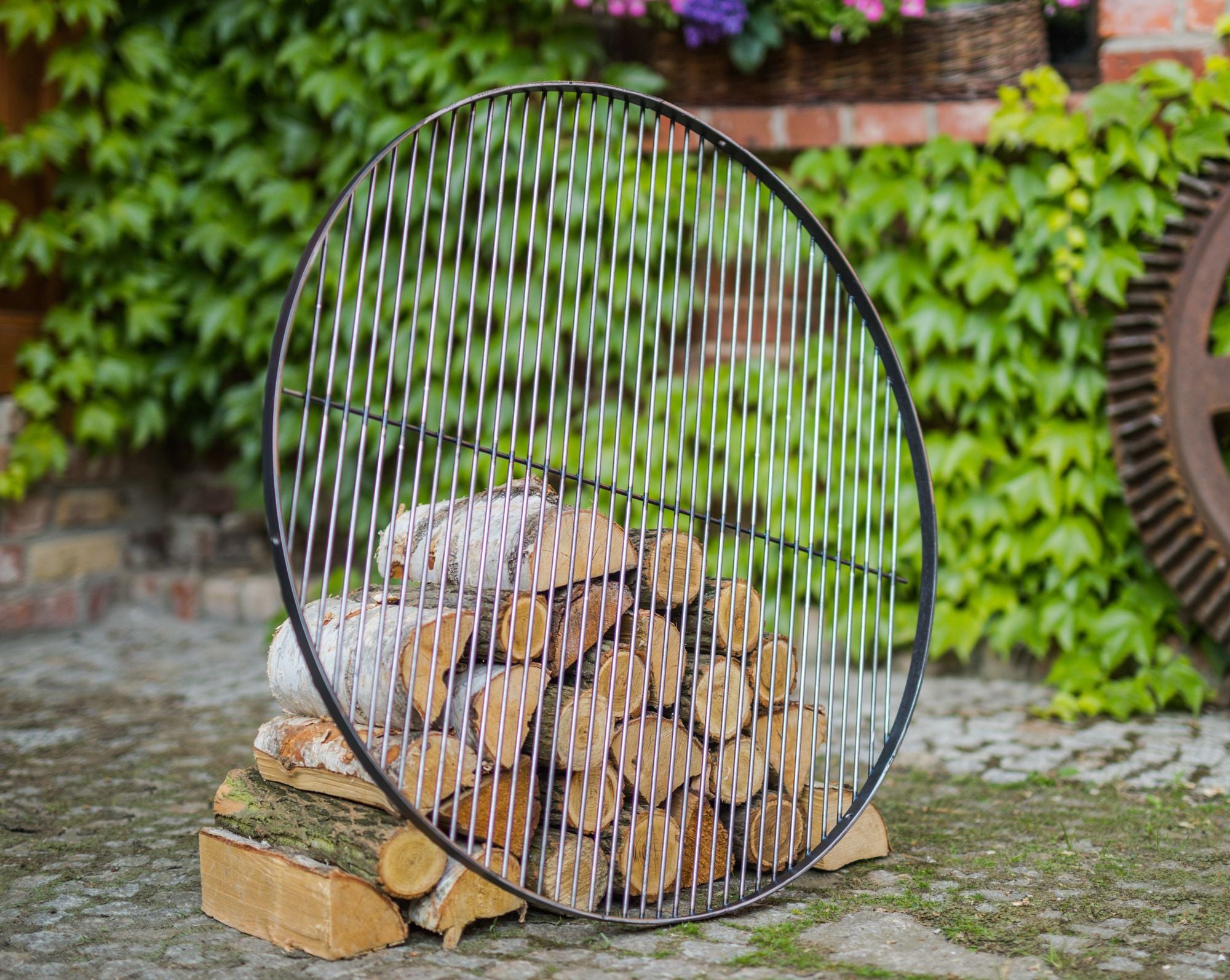 Cook King 50 cm Natural Steel Grate in an outdoor setting