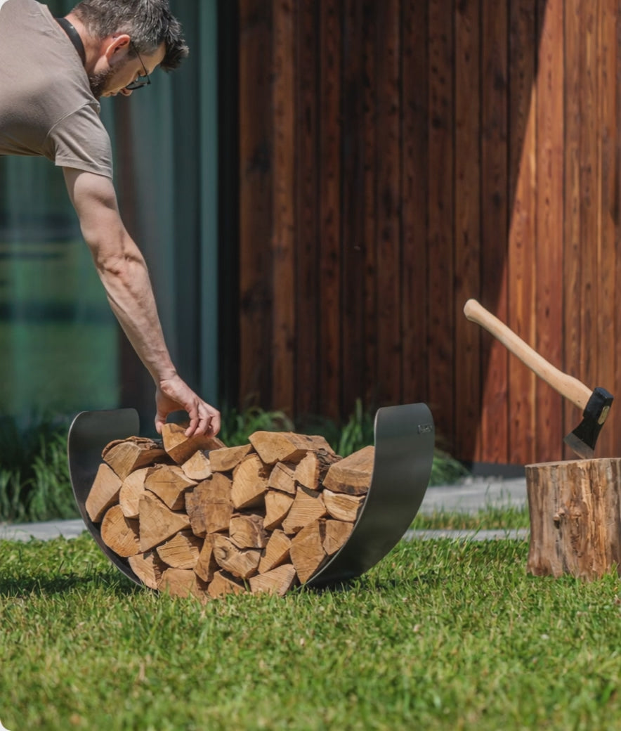 Cook King 60cm Wood Rack TURYN holding stacked logs outdoors