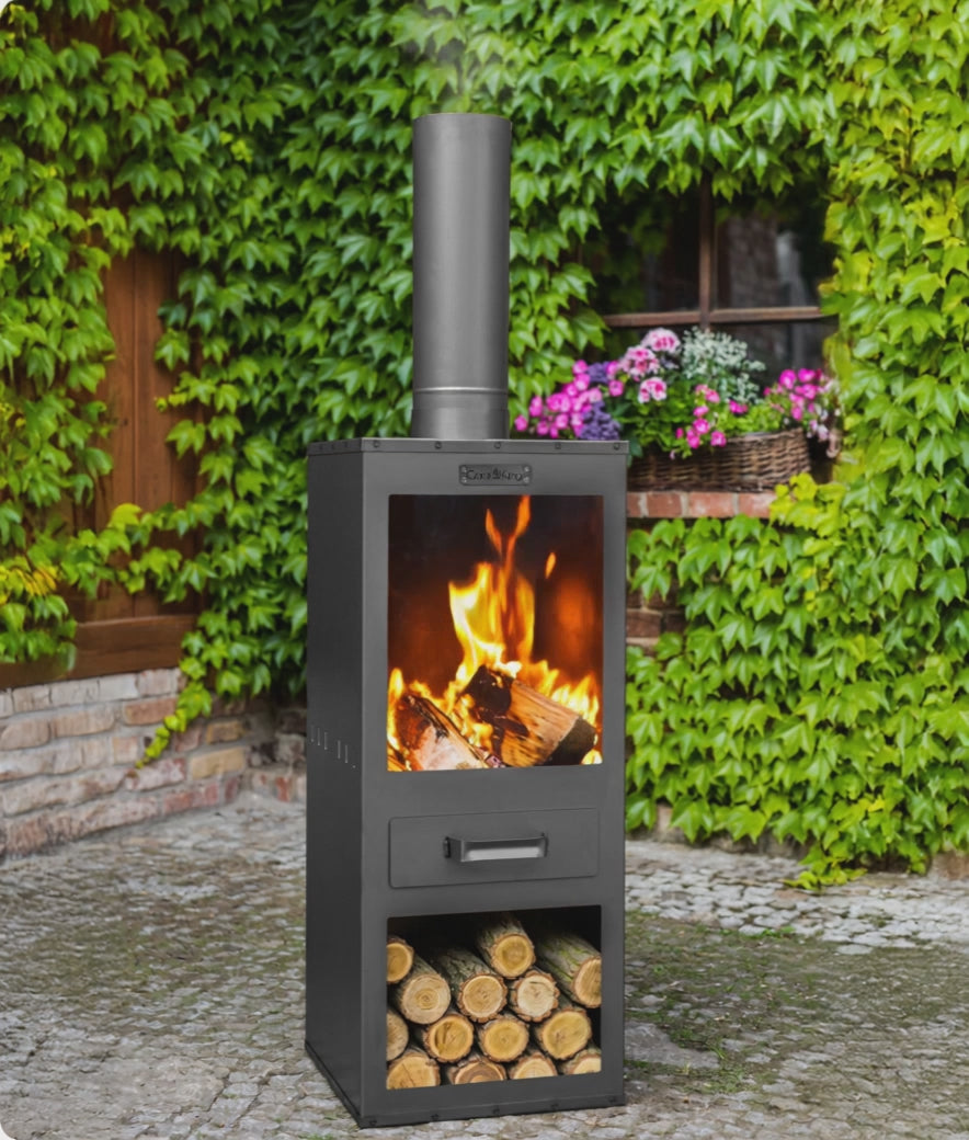 Cook King Garden Stove ROSA lit in a garden setting
