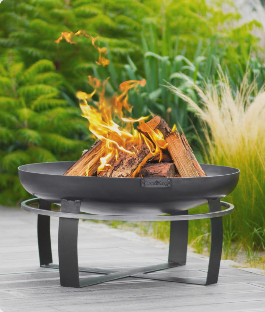 Cook King Viking 70cm Fire Bowl lit at dusk